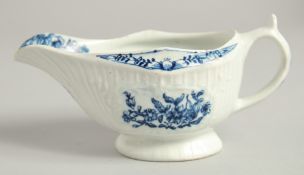 AN 18TH CENTURY LOWESTOFT FINE SMALL SAUCE BOAT with a pleat moulded body and moulded cartouches