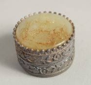 A SILVER AND JADE CIRCULAR BOX. 1.75ins diameter.