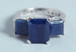 AN 18CT WHITE GOLD THREE-STONE SAPPHIRE AND DIAMOND RING