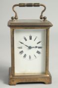 A FRENCH BRASS CARRIAGE CLOCK. 4.5ins high.