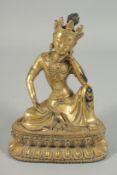 A GILT BRONZE SEATED DEITY. 8ins high.