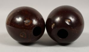 TWO POLISHED COCONUTS. 5.5ins.