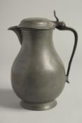 A LARGE 18TH CENTURY PEWTER JUG AND COVER. 10ins high.