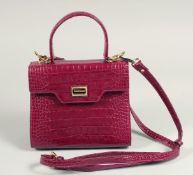 A SAGE BROWN CROCODILE BAG. 7.5ins x 6.5ins with handles and long leather straps.