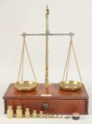 A VANDORE & CO., 56 LEADENHALL STREET, LONDON. A SET OF BRASS SCALES AND WEIGHTS in a mahogany