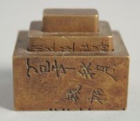 A CHINESE BRONZE THREE TIER SEAL