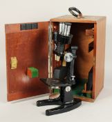 A C. BAKER LONDON, BLACK MICROSCOPE No. 20466. 12ins high in a mahogany case.