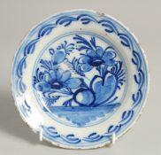 A SMALL 19TH CENTURY DELFT BLUE AND WHITE PLATE. 6.5ins diameter.