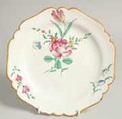 A 19TH CENTURY FRENCH PLATE painted with flowers. 9ins diameter.