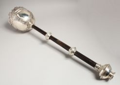 A SILVER MACE with wooden handles, presented to ASSHETON-LEAVER ESP. ENTRE NOUS. 25ins long,
