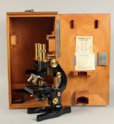 AN ERNST LEITZ WETZLAR MICROSCOPE. No. 287770. 13ins high in a mahogany case.