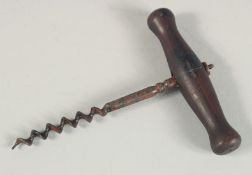A CORKSCREW with wooden handle. 4ins long.