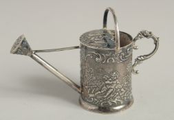 A SILVER WATERING CAN.2.5ins high.