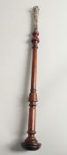 A TURNED WOOD AND SILVER TIPSTAFF. 20ins long.