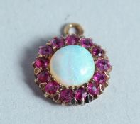 A RUBY AND OPAL CIRCULAR PENDANT.