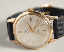 A GENTLEMAN'S 9CT GOLD TUDOR ROYAL SHOCK RESISTANT WRISTWATCH with leather strap.