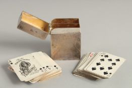 A VICTORIAN SILVER RECTANGULAR CARD CASE, complete with cards. 2.75ins high, London 1900, maker F.