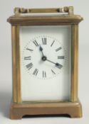 A FRENCH BRASS CARRIAGE CLOCK. 4.5ins high.