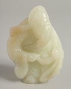 A GOLD TOP CARVED WHITE JADE FIGURE. 3ins.