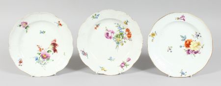 A SET OF THREE MEISSEN CIRCULAR PLATES sprigged and painted with flowers. Cross swords mark in blue.