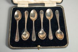 A SET OF SIX SILVER COFFEE SPOONS in a fitted case. Sheffield 1924.