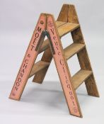 A NOVELTY PAIR PINK OF FOLDING WOODEN STEPS.