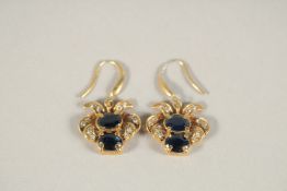 A PAIR OF RUSSIAN SILVER GILT, ENAMEL AND SAPPHIRE EARRINGS in a Faberge box.