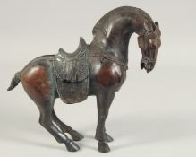 A CHINESE BRONZE STANDING HORSE
