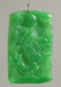 A GOLD TOP RECTANGULAR JADE PENDANT.