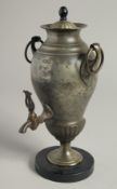 A 19TH CENTURY FRENCH TEA URN AND COVER on a circular wooden base. 10ins high.