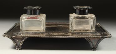 A RECTANGULAR TWO BOTTLE INKSTAND 8.5ins long, London, 1904.