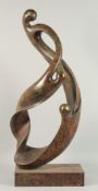 A LARGE ABSTRACT BRONZE OF TWO ENTWINED FIGURES. 2ft 11ins high.