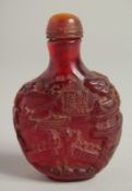 A CHINESE CARVED AMBER STYLE SNUFF BOTTLE AND STOPPER. 3ins high.