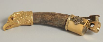 A FABERGE SILVER GILT MOUNTED HORN CIGAR CUTTER set with diamonds with eagle head. 7ins high.