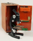 A COOKE TROUGHTON & SIMMS 15X MICROSCOPE. No. M103473. 12ins high in a mahogany case.