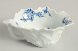 AN 18TH CENTURY WORCESTER BUTTER BOAT painted with the rare Butter boat Formal Rose pattern.