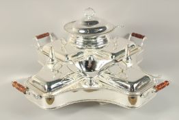 A VERY GOOD LARGE PLAIN LAZY SUSAN with centre tureen covers, four vegetable tureens and covers,