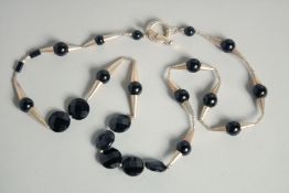 A SILVER AND BLACK JET NECKLACE.