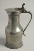 A 17TH CENTURY FLEMISH PEWTER JUG AND COVER 8ins high.