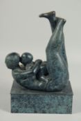 AFTER HENRY MOORE. MOTHER'S CHILD on a rectangular base. 13ins high.