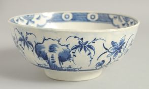 AN 18TH CENTURY WORCESTER BOWL painted with the uncommon Late Rock Floral pattern, crescent mark.