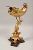 A GOOD GILT BRONZE SHELL held aloft by a classical female on a bronze base. 15ins high.