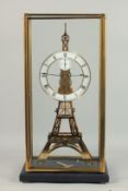 A GOOD SKELETON CLOCK OF THE EIFFEL TOWER. 1ft 10ins high in a glass case.
