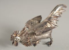 A ROYAL VICTORIAN CAST SILVER COCKEREL PEPPER the head as a stopper. 4.5ins long, London 1882,