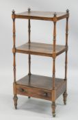A GOOD 19TH CENTURY ROSEWOOD THREE TIER WHATNOT with carved finials, turned column support, a drawer