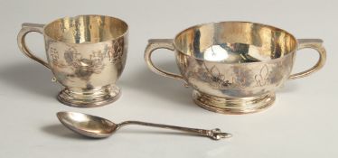 AN ASPREY SILVER THREE PIECE CHRISTENING SET, bowl, cup, and spoon in a fitted case. Birmingham