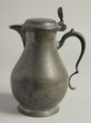 A LARGE 18TH CENTURY PEWTER JUG AND COVER. 10ins high.
