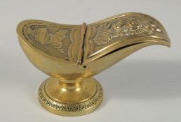 A BRASS SPOON WARMER. 5ins long.