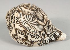A LARGE CARVED CONCH SHELL WITH HINDU GOD. 16cm long.