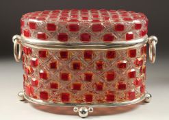 A LARGE SILVER PLATED AND CUT GLASS OVAL CASKET.